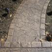 Small random stone stamped sidewalk with boarder